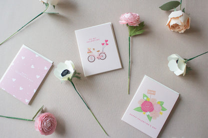 scattered Valentine’s themed cards and flowers