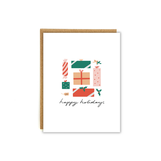 assorted christmas gifts with the words "happy holidays"