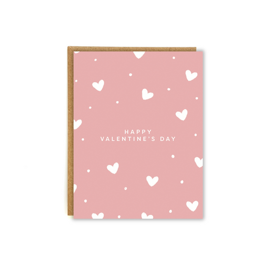 pink card with white heart patterns with the phrase "happy Valentine's Day"