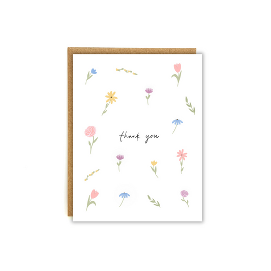 Text "thank you" surrounded by colorful florals