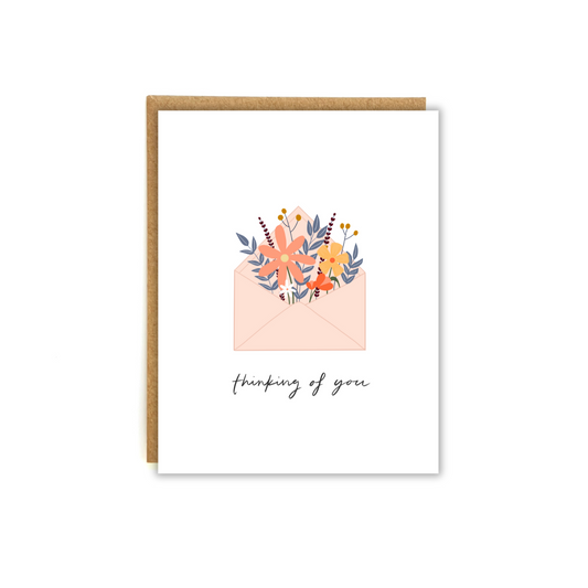 Card featuring an illustration of an envelope overflowing with flowers, with text below "thinking of you"